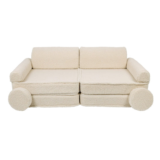 Complete bearly cream modular sofa assembled with backrests, armrests and round pillow supports