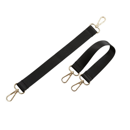 Two black shoulder straps with gold hardware for attaching to espresso backpack