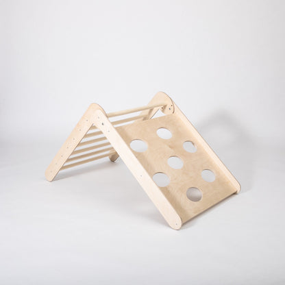 Wooden climbing triangle in steep slope position with hole details visible