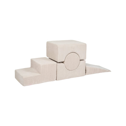 Five-element ecru foam building blocks arranged in different configuration showcasing stacking play possibilities