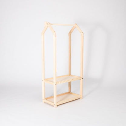 Natural wood house-shaped clothing rack frame with two open storage shelves, empty