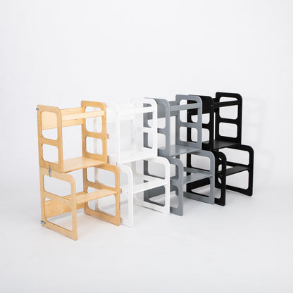 Lineup of natural wood, white, and black kitchen tower color variants