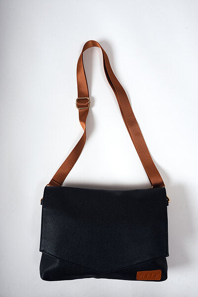 Black coffee baby handbag with cognac strap and brown leather patch, cross-body style
