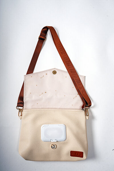 Cappuccino baby bag with open top compartment and visible wipe dispenser window