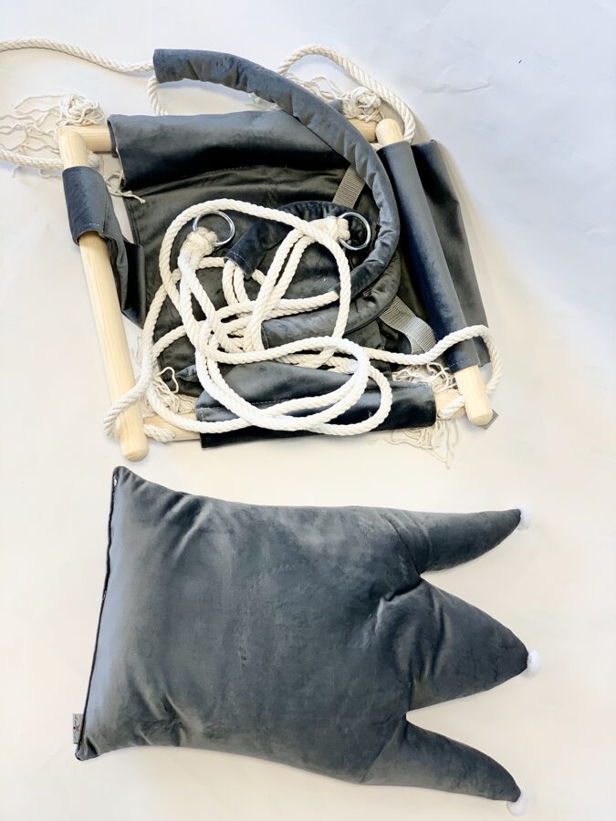 Grey crown shaped velvet cushion swing displayed flat with rope and wooden hardware