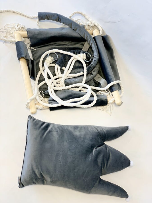 Grey crown shaped velvet cushion swing displayed flat with rope and wooden hardware