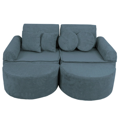 Turquoise modular kids sofa close-up showing textured fabric, round cushions and spacious seating