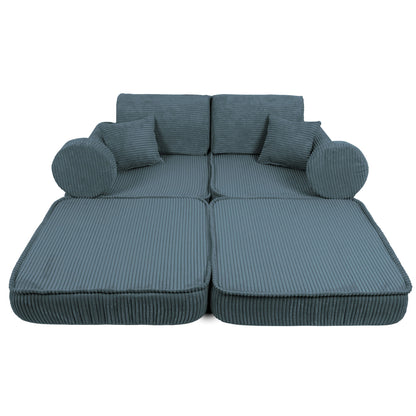 Top view of turquoise kids sofa showing flat bed configuration with accent pillows
