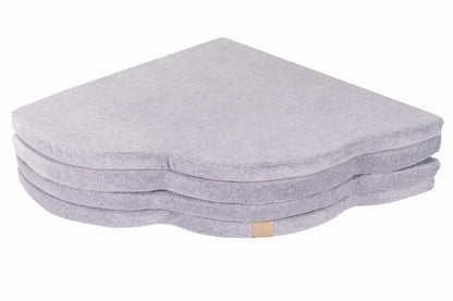 Side profile of stacked cloud play mat layers showing cushioned velvet construction