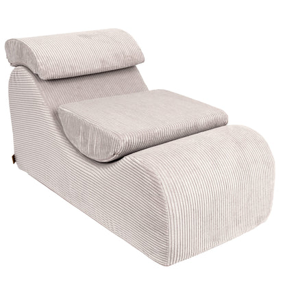 Wave Lounger in ecru with ribbed texture, angled three-quarter view showing full chair design