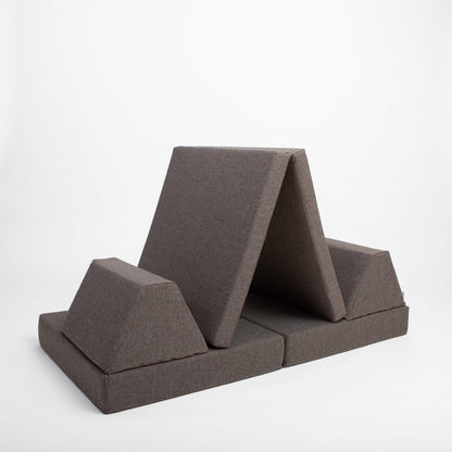 Dark brown foam furniture set arranged in tent formation with angled pieces and base cushions