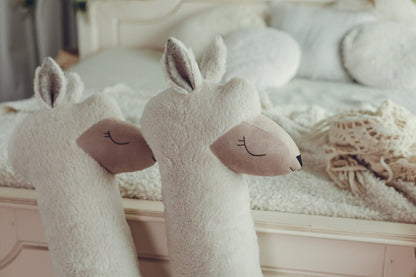 Close-up of vegan fur texture and eco suede face detail on giant plush alpaca – handmade quality
