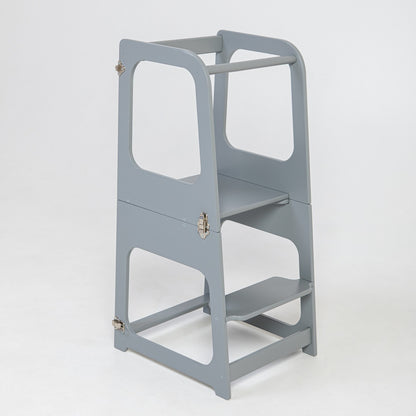 Grey Montessori learning tower standing upright with open sides