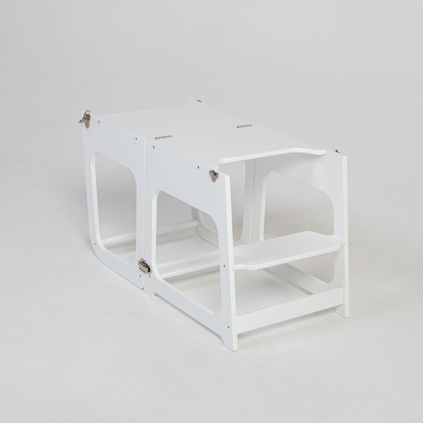 White kitchen tower transformed into table and seating configuration