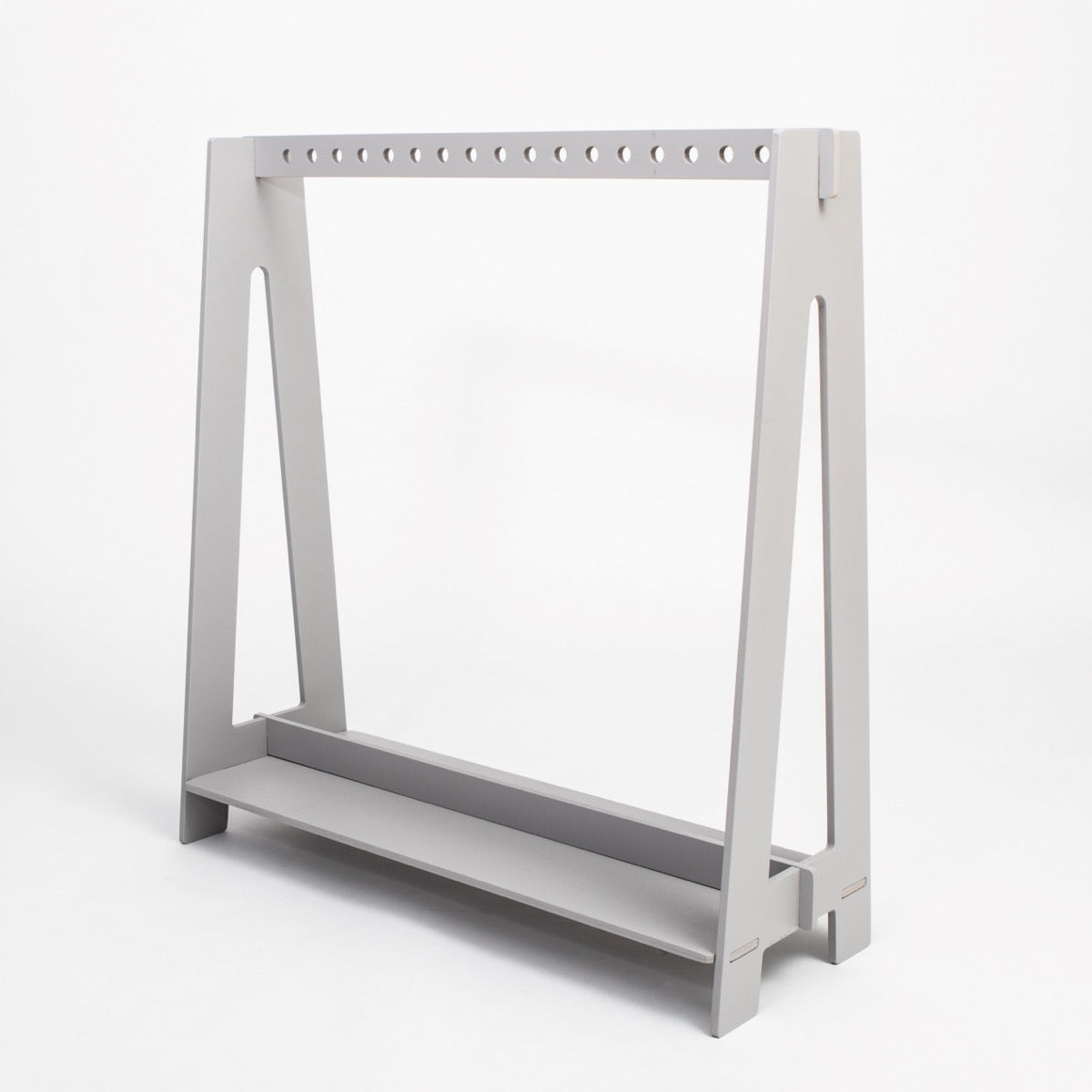 Grey birch plywood toddler clothing rack with hanging rod and storage shelf