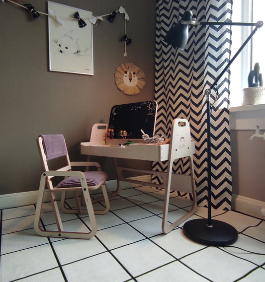 Cannon pink Montessori table and chair set in modern bedroom with chalkboard and paper roll