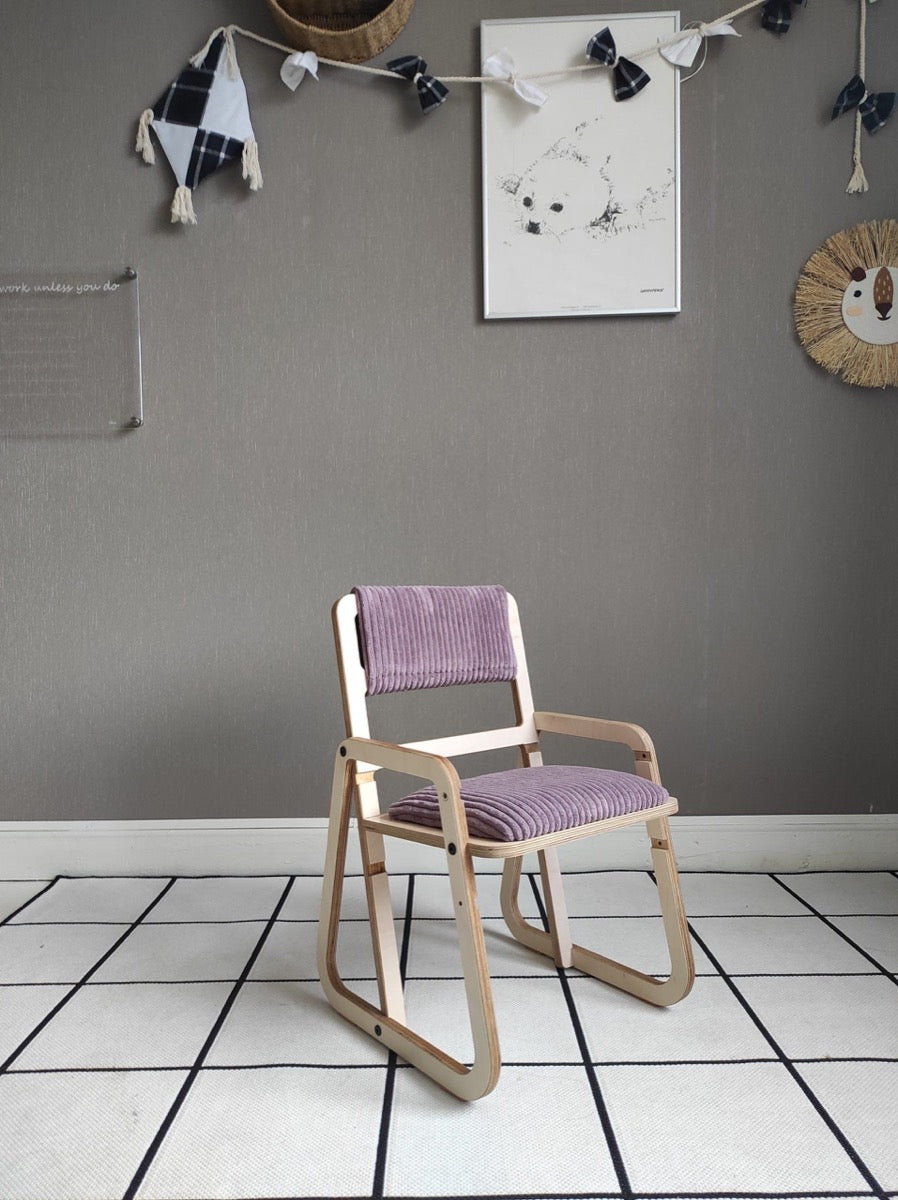 Cannon pink Montessori chair in room setting with artwork and storage accessories