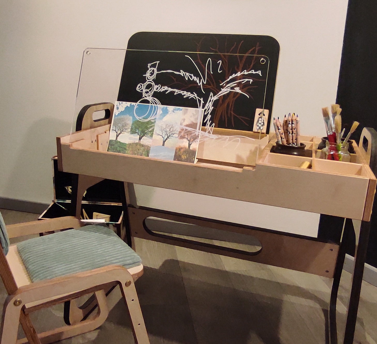 Montessori table and two cannon pink chairs in styled room setting