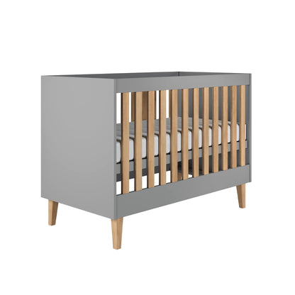 Baby Bed Kubi Scandinavian Baby Cot Grey – front view grey grey wood crib solid oak legs | Nestling