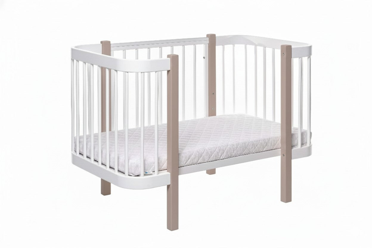 KOTTO ELIN crib with included mattress showing adjustable height in side view