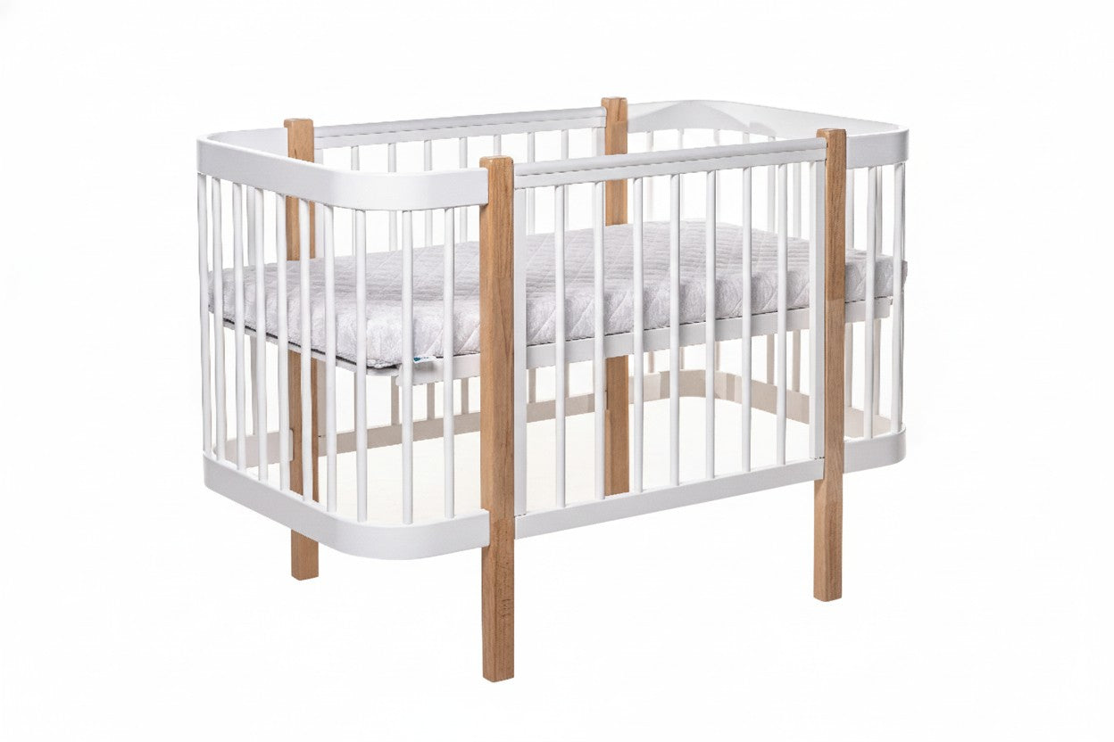 KOTTO ELIN baby crib with white frame and natural beechwood posts, shown with removable side panel