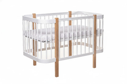 KOTTO ELIN baby crib with white frame and natural beechwood posts, shown with removable side panel