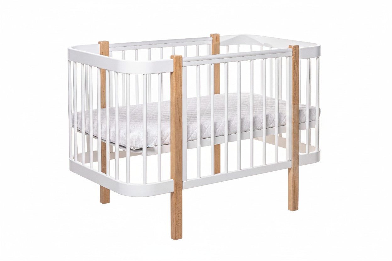 ELIN beechwood crib with removable side panel in closed position, front view