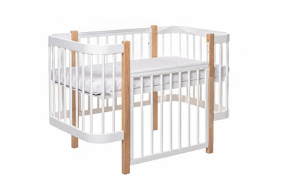 ELIN crib with removable side panel opened flat for toddler transition mode access
