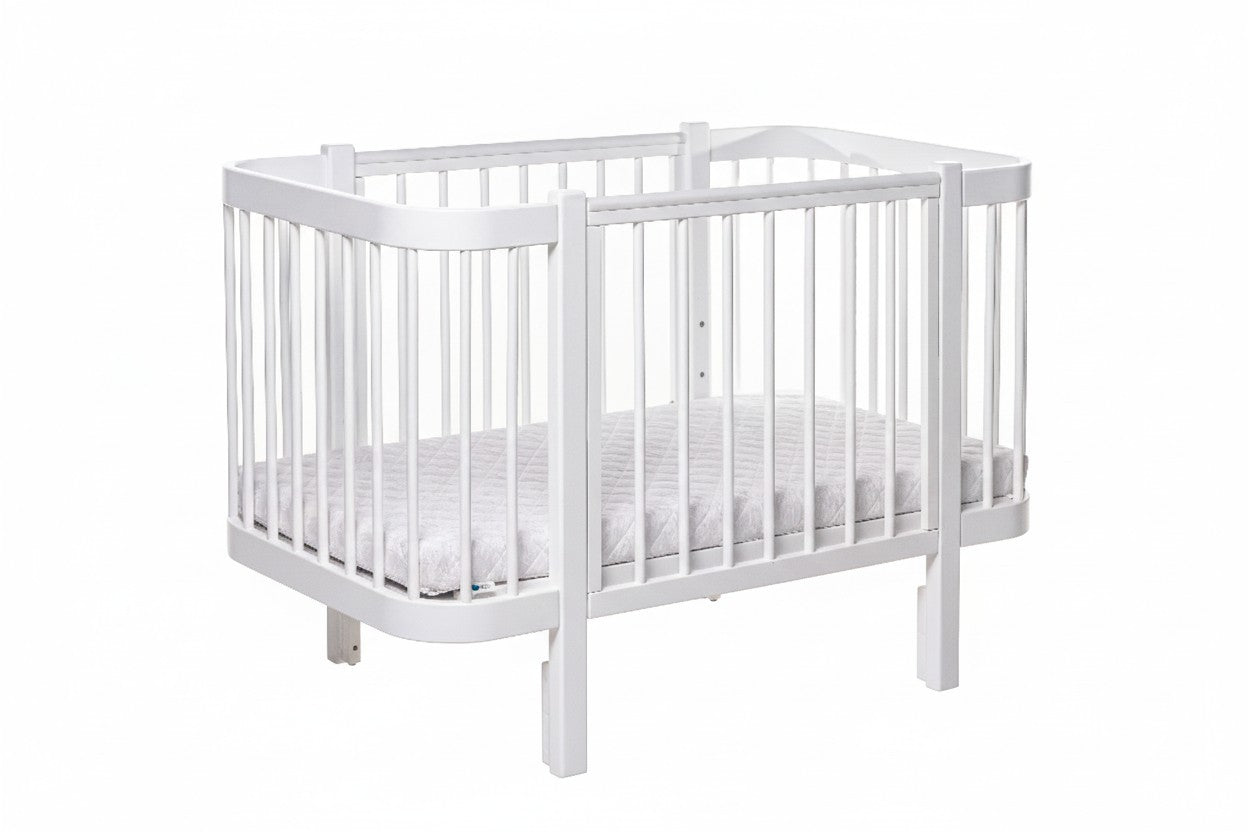 White KOTTO ELIN beechwood crib with one side panel open for toddler bed conversion mode