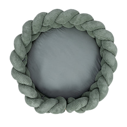Olive green braided crib bumper detail showing woven texture and padded interior