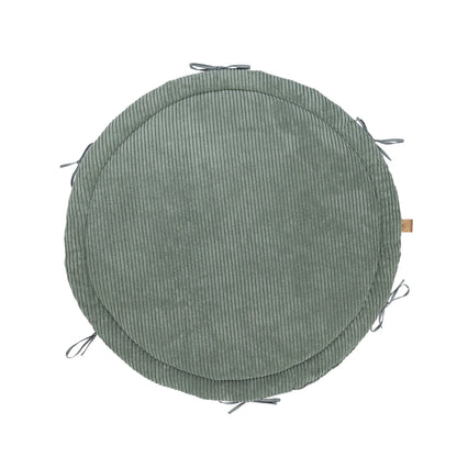 Olive green baby nest play mat with braided crib bumper border, top view