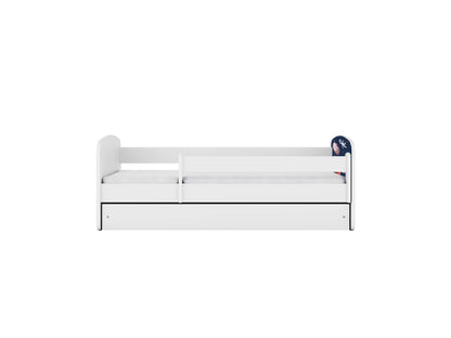 White kids bed with removable cosmos print side guard and storage drawer, top view