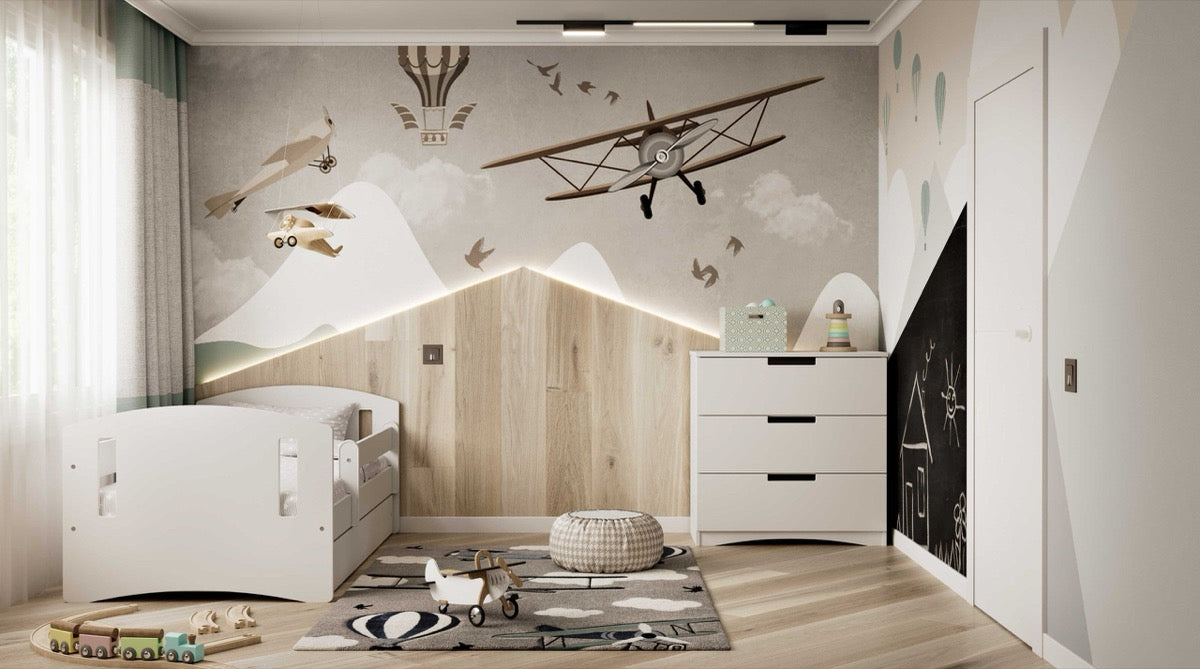 White children's bed in playroom setting with natural wood accents and toys