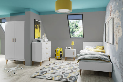 White Kubi bed in colorful kids bedroom with oak legs and headboard