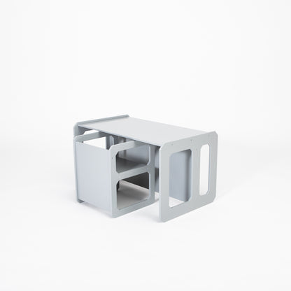 White Montessori weaning table with built-in chair compartment, overhead view