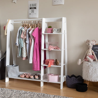 White painted kids wardrobe rack with hanging clothes, shelf storage, and pink accents
