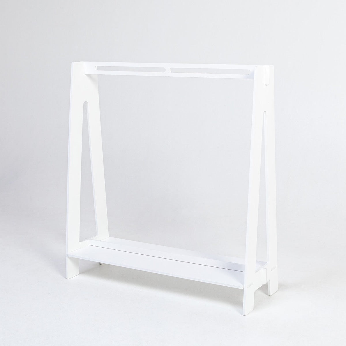 White birch plywood toddler clothing rack, front view showing frame and storage shelf
