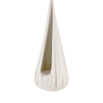 White cotton cocoon swing hanging from ceiling mount with soft corduroy cover and plush cushion interior