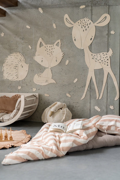 Forest animal wooden wall decals featuring spotted deer, fox, and hedgehog in nursery