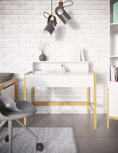 White Scandinavian kids desk with oak legs in modern bedroom workspace with pendant lights and shelving