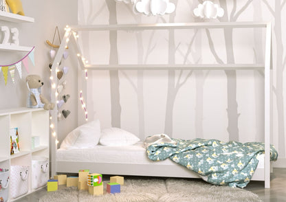 White pine Bella house bed with low floor frame and playful roof design in nursery