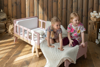 Two girls playing on pink Family-scl extendable kids bed – space-saving toddler bed for siblings