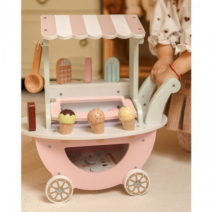 Wooden ice cream cart in bedroom setting with girl engaging in pretend play