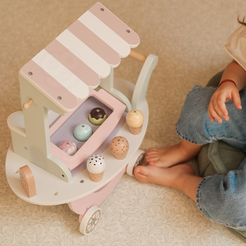 Top-down view of wooden ice cream cart showing magnetic scoops and pastry accessories