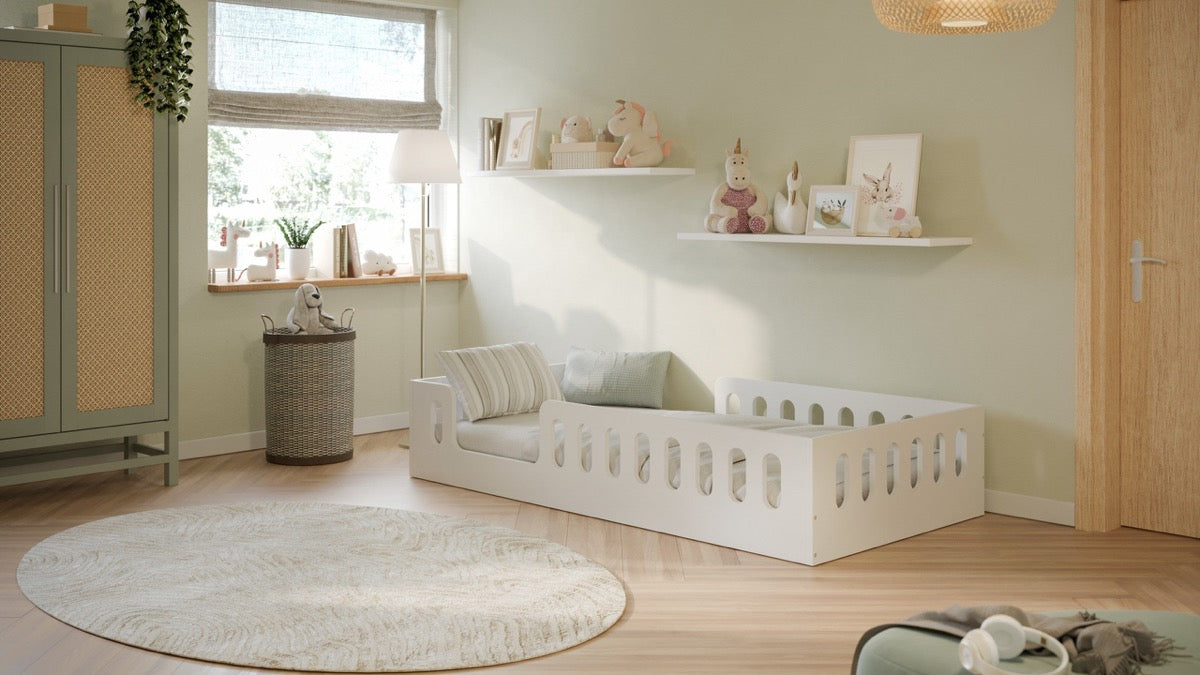 Space-saving white floor bed frame in styled children's bedroom with round rug