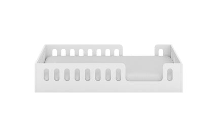 Floor bed frame side view showing safety rail slots and low height design