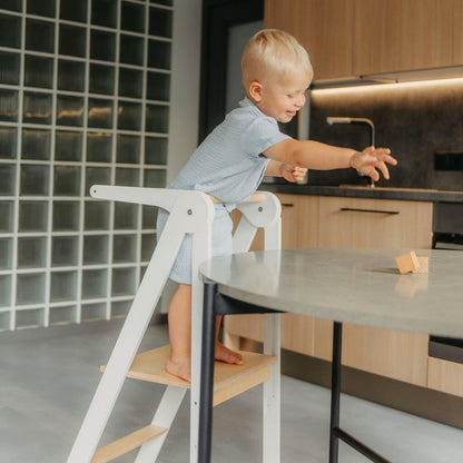 Grey removable rail and handle detail on kitchen tower showing metal attachment and wooden construction