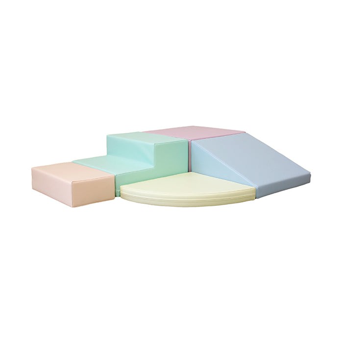 Pastel foam corner climber blocks arranged in L-shape configuration