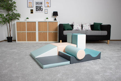 Children's foam climbing blocks set up in living room playspace