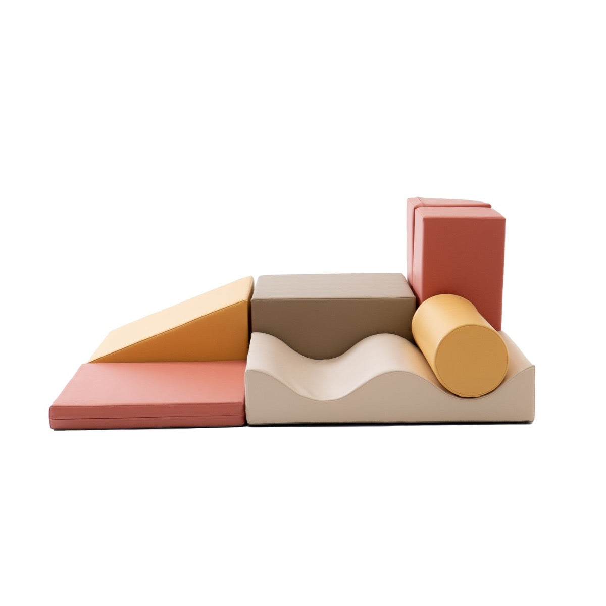 Low-angle view of IGLU Discoverer foam climbing set showing all 7 pieces in pastel pink and neutral tones